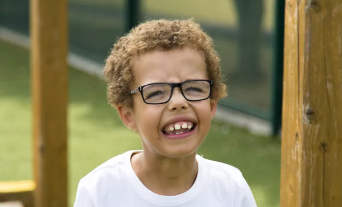 A young boy smiles