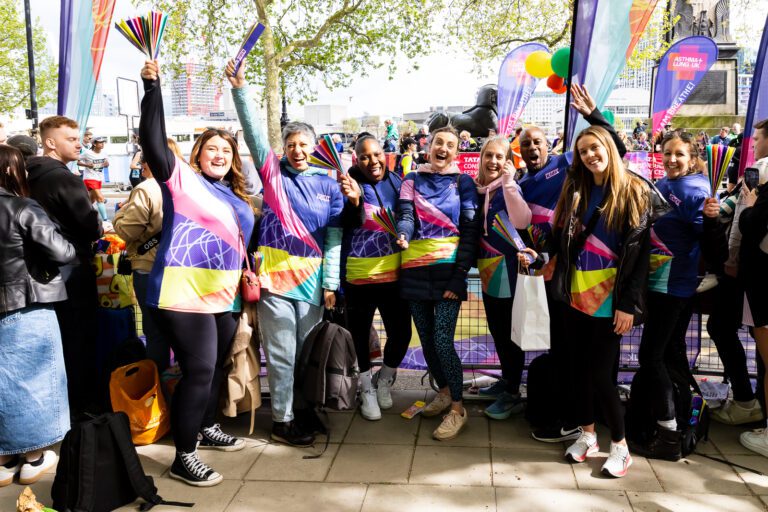 A group of Kids volunteers are cheering at the London Marathon