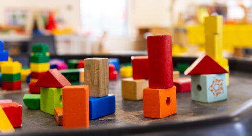 children's multicoloured wooden block toys in playgroup setting